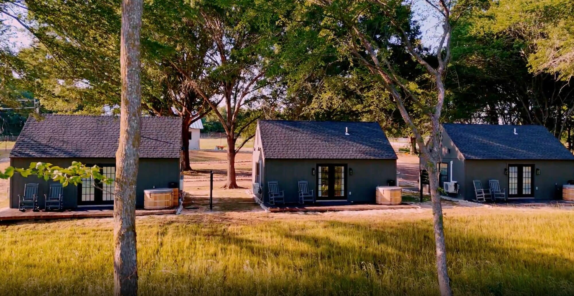 Cabins with private cedar soaking tubs at an intimate wedding venue in Texas, Limestone Fields on Lake Limestone